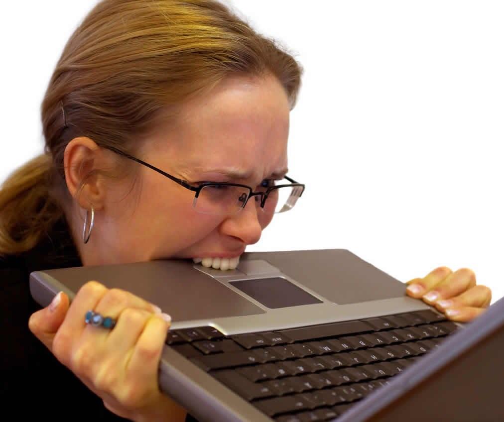 woman biting laptop